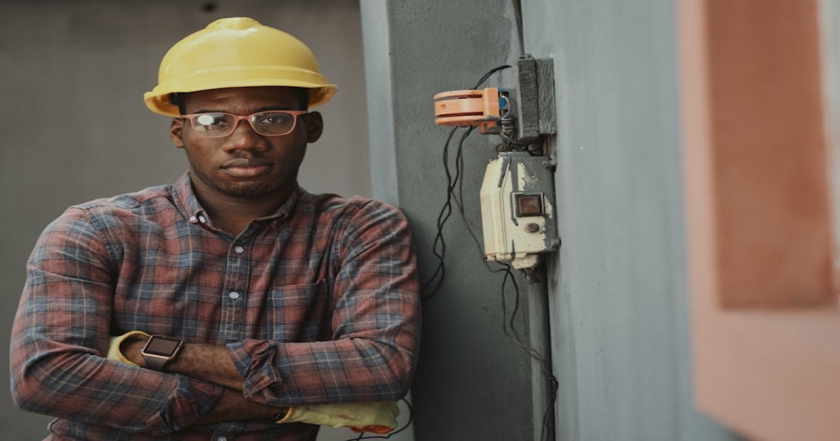 Electrician inspecting home electrical panel